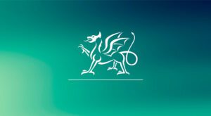 The welsh government logo: a dragon with one leg lifted