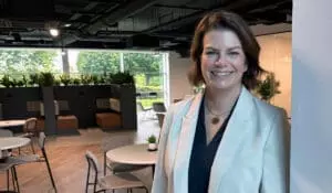 Victoria Walton, Head of People at Procure Smart, standing in the business' reception area