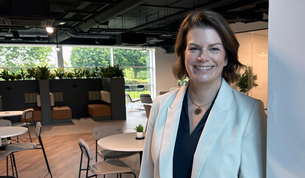 Victoria Walton, Head of People at Procure Smart, standing in the business' reception area